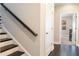 Hallway with stairs and hardwood floors leading into a bedroom at 345 Glen Iris Ne Dr # 5, Atlanta, GA 30312