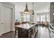 Bright kitchen featuring a center island, pendant lighting, stainless steel appliances, and an open-concept design at 345 Glen Iris Ne Dr # 5, Atlanta, GA 30312