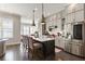 Modern kitchen featuring stainless steel appliances, a central island with seating, and bright lighting at 345 Glen Iris Ne Dr # 5, Atlanta, GA 30312