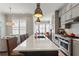 This kitchen features a center island, stainless steel appliances, and lots of natural light at 345 Glen Iris Ne Dr # 5, Atlanta, GA 30312