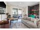 This stylish living room features a wet bar, sliding glass doors, and comfortable seating at 345 Glen Iris Ne Dr # 5, Atlanta, GA 30312