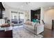 Living room with a sliding glass door, minibar, and gray sofa at 345 Glen Iris Ne Dr # 5, Atlanta, GA 30312