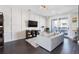 Living room featuring a large tv, white trim wall and a gray sofa at 345 Glen Iris Ne Dr # 5, Atlanta, GA 30312