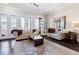 Spacious living room with hardwood floors, comfortable seating, and French doors for outdoor access at 345 Glen Iris Ne Dr # 5, Atlanta, GA 30312