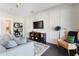 Living room with white trim accent wall, gray sofa, and dark hardwood floors at 345 Glen Iris Ne Dr # 5, Atlanta, GA 30312