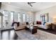 Inviting living room with natural light, hardwood floors, and balcony access through French doors at 345 Glen Iris Ne Dr # 5, Atlanta, GA 30312