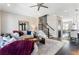 Cozy living room featuring comfortable seating, a staircase, and open layout at 345 Glen Iris Ne Dr # 5, Atlanta, GA 30312