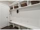 Organized mudroom featuring built-in shelves and bench, offering efficient storage at 345 Glen Iris Ne Dr # 5, Atlanta, GA 30312
