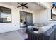 Spacious covered patio with comfortable seating, a fireplace, a ceiling fan, and modern amenities for outdoor gatherings at 345 Glen Iris Ne Dr # 5, Atlanta, GA 30312