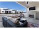 Cozy covered patio with an outdoor fireplace, comfortable seating, and a view of the neighborhood at 345 Glen Iris Ne Dr # 5, Atlanta, GA 30312