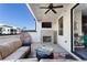 Inviting covered patio with a fireplace, comfortable seating, a hanging chair, and modern amenities for outdoor enjoyment at 345 Glen Iris Ne Dr # 5, Atlanta, GA 30312