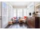 Sunlit sitting area with armchairs, shutters, and built-in cabinet at 345 Glen Iris Ne Dr # 5, Atlanta, GA 30312
