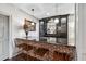 Charming bar area with brick accents, granite counters, and custom cabinetry at 3816 Turnberry Ct, Duluth, GA 30096