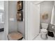 Bright bathroom featuring gray walls, white trim, and a classic shower curtain at 3816 Turnberry Ct, Duluth, GA 30096