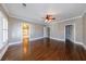 Expansive bedroom with hardwood floors, ceiling fan, and multiple doorways/entryways at 3816 Turnberry Ct, Duluth, GA 30096