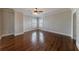 An airy bedroom with gleaming hardwood floors and natural light offers a peaceful retreat at 3816 Turnberry Ct, Duluth, GA 30096