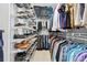Well-organized walk-in closet with shelves and rods for clothing and accessories at 3816 Turnberry Ct, Duluth, GA 30096