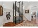 Home elevator and staircase with wood floors, carpeted stairs, and framed artwork at 3816 Turnberry Ct, Duluth, GA 30096