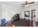The workout room features fitness equipment and a mirror for exercise with hardwood floors and plenty of light at 3816 Turnberry Ct, Duluth, GA 30096