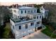 Multi-story home with a rooftop patio, outdoor seating, and a three-car garage at 3816 Turnberry Ct, Duluth, GA 30096