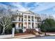 Stately two-story home with grand columns and wrought iron balconies at 3816 Turnberry Ct, Duluth, GA 30096