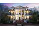 Elegant two-story home with classic columns and wrought iron balconies at 3816 Turnberry Ct, Duluth, GA 30096