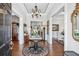 Elegant foyer with hardwood floors, chandelier, and classic decor at 3816 Turnberry Ct, Duluth, GA 30096