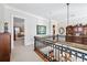 Second story hallway featuring wood accents, natural lighting, and a railing at 3816 Turnberry Ct, Duluth, GA 30096