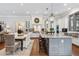 Eat-in kitchen features a center island with seating and stainless steel appliances at 3816 Turnberry Ct, Duluth, GA 30096