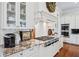 Modern kitchen with stainless appliances, gas range, custom hood and granite countertops at 3816 Turnberry Ct, Duluth, GA 30096