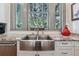 Kitchen sink with stainless appliances, granite countertop and window at 3816 Turnberry Ct, Duluth, GA 30096