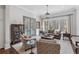 Bright living room features a large window, comfortable seating, and access to an outdoor deck at 3816 Turnberry Ct, Duluth, GA 30096