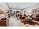 Beautiful living room featuring rich hardwood floors, a leather sofa, and plenty of space at 3816 Turnberry Ct, Duluth, GA 30096