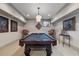 Enjoy recreational time in this room with a classic pool table, soft lighting at 3816 Turnberry Ct, Duluth, GA 30096