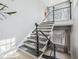 Modern staircase featuring metal railings, large windows, and plenty of natural light at 3816 Turnberry Ct, Duluth, GA 30096