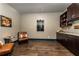 Home bar boasts custom wine storage, elegant countertop, and wood flooring at 427 Parkbrook Way, Canton, GA 30114