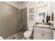 Modern bathroom with a glass-enclosed shower and granite vanity at 427 Parkbrook Way, Canton, GA 30114