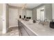 Modern bathroom with double vanity, undermount sinks, gray cabinets, quartz counters, and neutral paint at 427 Parkbrook Way, Canton, GA 30114