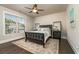 Cozy bedroom with stylish furniture, rug, and hardwood floors at 427 Parkbrook Way, Canton, GA 30114