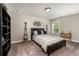 Neutral bedroom with unique accents, carpet, and a window view at 427 Parkbrook Way, Canton, GA 30114