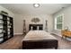 Neutral bedroom with unique accents, carpet, and a window view at 427 Parkbrook Way, Canton, GA 30114