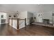 Spacious bonus room with hardwood floors, art displays, and a connecting bathroom at 427 Parkbrook Way, Canton, GA 30114