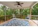Relax on this charming covered porch with rocking chairs overlooking a wooded view at 427 Parkbrook Way, Canton, GA 30114
