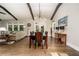 Open-concept dining room with hardwood floors, stylish lighting, and adjacent living space at 427 Parkbrook Way, Canton, GA 30114