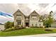 Charming two-story home boasting a well-manicured lawn and craftsman-style details at 427 Parkbrook Way, Canton, GA 30114