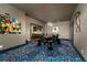 Spacious game room with poker table, custom lighting, and bold patterned carpet at 427 Parkbrook Way, Canton, GA 30114