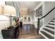 Entryway with hardwood floors, stairs, and stylish decor elements at 427 Parkbrook Way, Canton, GA 30114