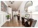 Hallway with hardwood flooring, console table, and decorative mirror at 427 Parkbrook Way, Canton, GA 30114