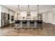 Stylish kitchen featuring a large island with bar stools, modern appliances, and ample cabinet space at 427 Parkbrook Way, Canton, GA 30114