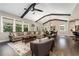 Bright living room with large windows, hardwood floors, and comfortable sectional sofa at 427 Parkbrook Way, Canton, GA 30114